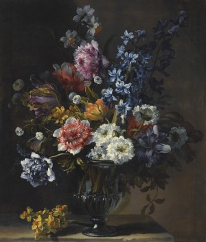 A still life with tulips, a hyacinth, and other flowers in a glass vase on a stone plinth